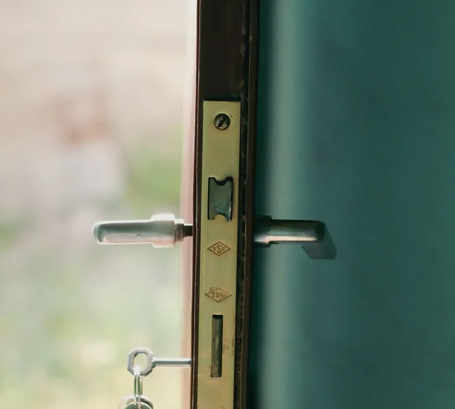 Door edge with a lock faceplate, lever handles and key – checking the multipoint mechanism before you change a uPVC door lock in Consett, Locksmith Consett guide