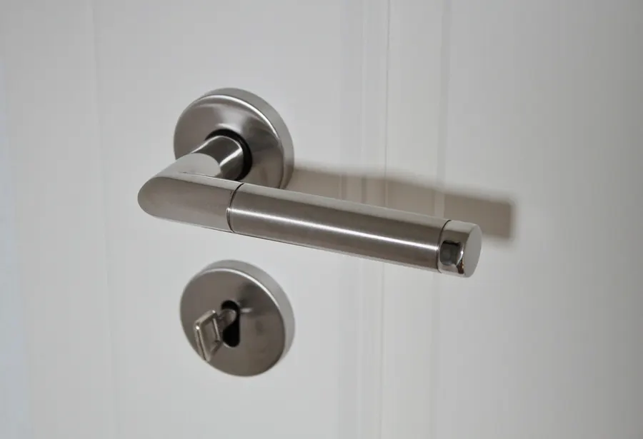 Modern lever door handle with a thumb turn