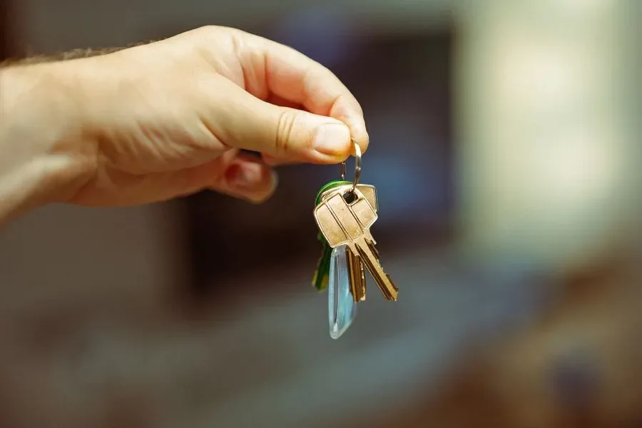Hand holding a set of house keys – residential locksmith Consett help for landlords and letting agents from Locksmith Consett