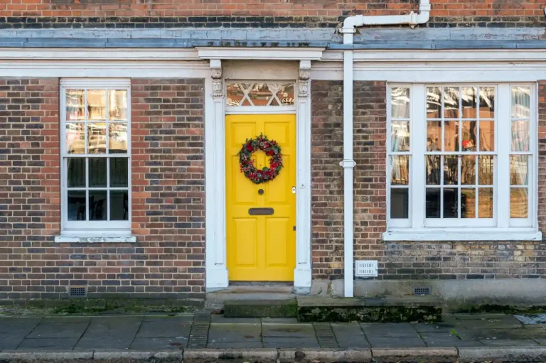 Types of door locks in the UK – yellow front door on a red-brick Victorian house in Consett, Locksmith Consett guide to identifying your lock